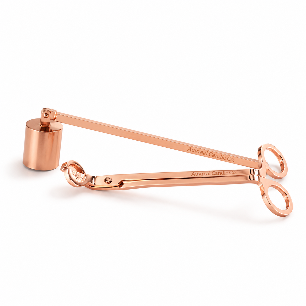 Rose gold candle snuffer on a white background